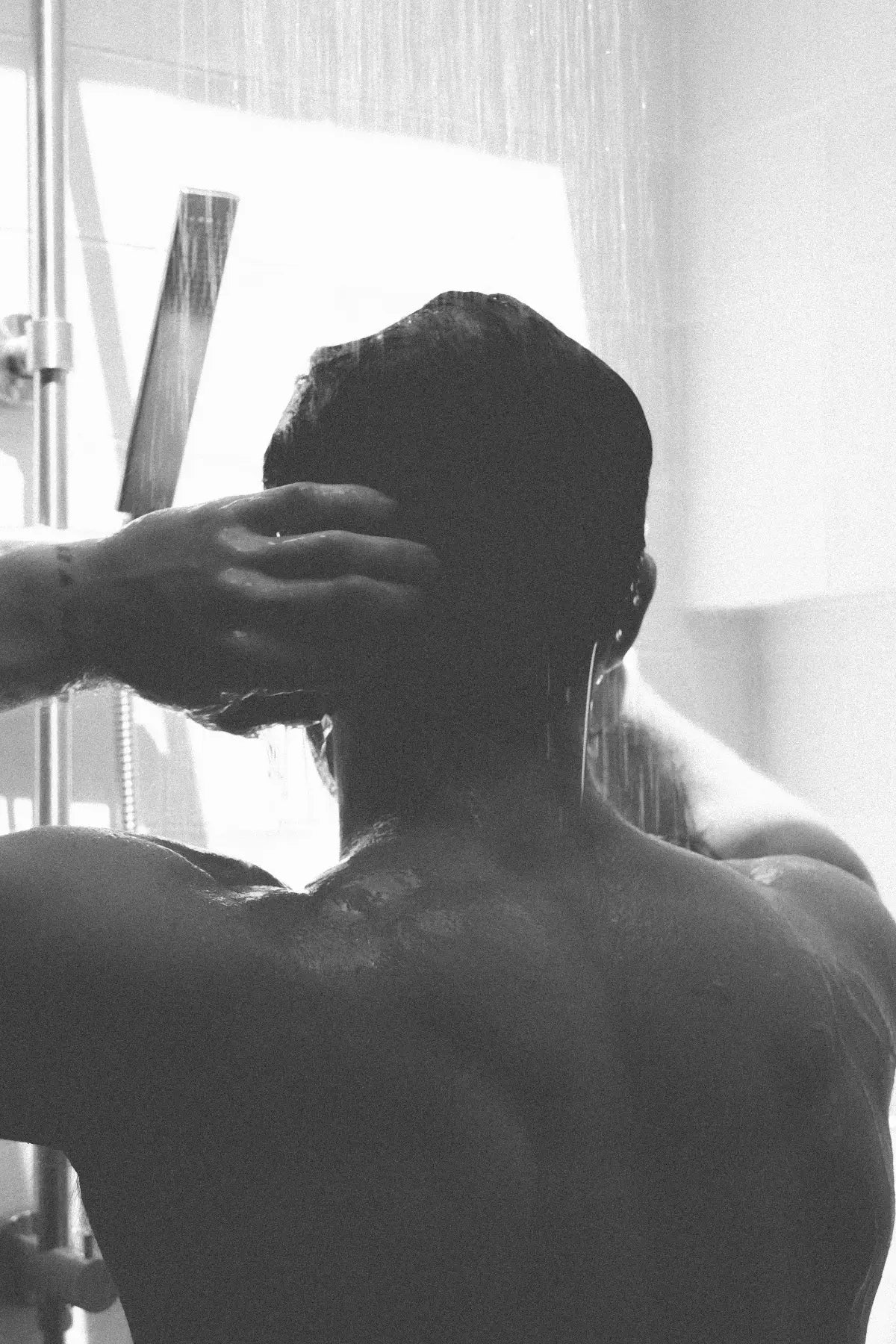 Man in shower, morning skincare ritual — Ashford Valle